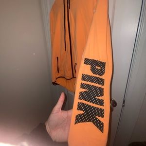 Victoria’s Secret pink jacket with hood and reflective designs.